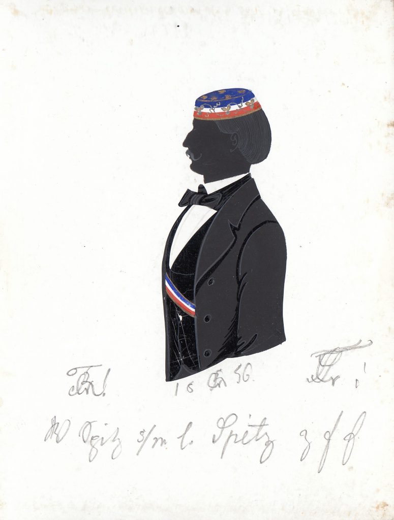 Wilhelm Spieß kam am 26. Februar 1833 in Selters als Sohn des Pfarrers Johann Wilhelm Leonhard Selters (1793-1868) und dessen Ehefrau Christiane geb. Pfluger (1799-1859) zur Welt. Er kam mit 21 Jahren an die Universität Heidelberg, wo er sich am 3. Mai 1854 als Student der Mineralogie immatrikulierte. Noch im selben Jahr wurde Spieß in die Rhenania recipiert und war dort einmal Drittchargierter. Später arbeitete er als Bergwerksdirektor in der Christianshütte bei Limburg an der Lahn und starb am 31. Dezember 1890. Er war verheiratet mit Amalie Winter (1847-1881). Die Silhouette ist gewidmet "18 [R] 56. W. Spitz [Z!] s/m l. Spitz [Z!] z f E." Archiv des Corps Franconia Tübingen, Silhouettenalbum des Karl Schmidt