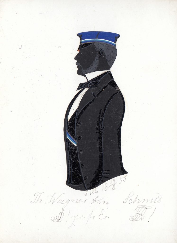Theodor Wagner wurde am 7. Juli 1833 in Altenburg als Sohn des Medizinalrates Dr. Gustav Wagner geboren. Nach dem Abitur immatrikulierte er sich in Leipzig und wurde bei Saxonia aktiv, in die er 1853 recipiert wurde. Er war zweimal Drittchargierter und wechselte später den Studienort nach Tübingen, wo er sich am 2. November 1854 als stud. iur. immatrikulierte. Nach dem Studienabschluss war Wagner als Geheimer Finanzrat in seiner Heimatstadt tätig und starb 1904. Die Silhouette ist gewidmet "Tüb 18 14/8 55 Th. Wagner [Z!] s/m Schmid [Z!] zr. fr. Er." Archiv des Corps Franconia Tübingen, Silhouettenalbum des Karl Schmidt