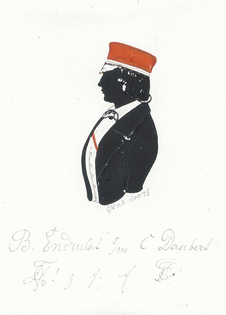 Bernhard Ferdinand Julius Endrulat wurde am 24. August 1828 in Berlin geboren und am 14. September getauft. Seine Eltern waren Heinrich Endrulat und dessen Ehefrau Friederike Wilhelmine geb. Horn. Er besuchte die königliche Realschule, wechselte später zunächst auf das Joachimsthalsche Gymnasium und schließlich auf das Friedrich-Wilhelms Gymnasium, wo er Ostern 1848 sein Abitur ablegte. Direkt im Anschluss immatrikulierte er sich als stud. phil. an der Universität seiner Geburtsstadt und schloss sich der Marchia an, in die er 1849 recipiert wurde. Endrulat brach das Studium im folgenden Frühjahr ab und wurde Soldat. Als solcher nahm er an den Feldzügen in Schleswig-Holstein teil. 1851 verließ er das Militär und wurde zunächst Hauslehrer in Holstein, bis er 1854 an die höhere Mädchenschule in Hamburg berufen wurde. Zehn Jahre später wurde Endrulat von Friedrich VIII. von Schleswig-Holstein zum Leiter seines Preßbureaus ernannt und wirkte nebenher als privater Schriftsteller und Lehrer. Am 8. Januar 1865 heiratete er in Kiel Charlotte Adelheid Fernandine Hennings (geb. 1841) und trat schließlich 1876 eine Stelle als Kandidat am königlichen Staatsarchiv in Düsseldorf an. Danach war Endrulat am Aufbau des Reichskammergerichtsarchivs in Wetzlar beteiligt. Später war er Archivar dortselbst und ab 1885 Staatsarchivar in Posen. Endrulat starb im folgenden Jahr am 17. Februar in Posen. Die Silhouette ist gewidmet "Jena Nov.48 - B. Endrulat [Z!] s/m C. Daubert [Z!] z. f. E." Archiv des Corps Marchia Berlin