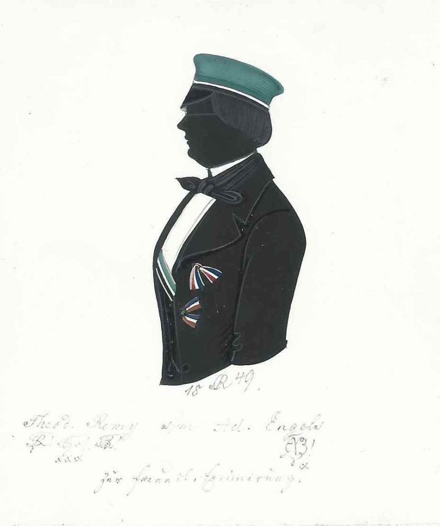 J. Theodor M. H. Remy wurde ca. 1828 in Eupen als Sohn des Bäckermeisters Jean-Caspar Remy (1794-1837) und dessen Ehefrau Maria Brüll (1791-1889) geboren und katholisch getauft. Nach dem Abitur immatrikulierte er sich am 21. Oktober 1846 als stud. cam. an der Universität zu Bonn und trat nur fünf Tage später am 26. Oktober der Rhenania bei. Am 4. Juli 1847 wurde er rezipiert. Michaelis 1848 immatrikulierte er sich in Berlin als stud. iur. et cam. und wurde bei der dortigen Guestphalia erneut aktiv. Einmal war er Drittchargierter. Am 30. Juni 1849 schrieb er sich schließlich in Heidelberg ein und wurde ein drittes mal bei Rhenania aktiv. Noch einmal wechselte er die Universität und immatrikulierte sich am 1. Mai 1850 erneut in Bonn, wo er zuvor am 18. März auch wieder in die Rhenania eingetreten war. Wegen Streitigkeiten mit dem CC wurde er am 4. August 1850 excludiert. Anschließend stand er in einem losen Verhältnis zur Bonner Saxonia, für die er auch sekundierte. Seinetwegen wurde das dreißig Jahre alte Kartell der Rhenania Bonn mit Rhenania Heidelberg gebrochen. Später war Remy wohl als Schriftsteller in New York tätig und starb am 21. Dezember 1881 in Liege (Belgien). Silhouette gewidmet „18 [R] 49. - Theod. Remy [Z!] [Z!] xxx [Z!] s/m Ad. Engels [Z!] x – Zur freundl. Erinnerung.“ Kölner Privatsammlung