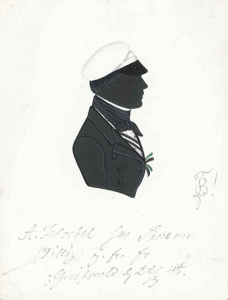 Albert Hoebel stammte aus Veltheim in Westfalen und immatrikulierte sich Ostern 1843 an der Universität Greifswald als stud. iur. Dort trat er in die Borussia ein und wurde noch im selben Jahr rezipiert. Einmal war er Senior. 1845 wechselte er an die Universität Halle und wurde nochmals bei der dortigen Guestphalia aktiv. Er starb 1878. Silhouette gewidmet „A. Hoebel (Tilly) sm Simon – z. fr. Er. – Greifswald d. 22/3 45.“ Sammlung Dr. Rolf Caselitz Hubertiae München, Starkenburgiae, Saxoniae Leipzig, Brunsvigae, Borussiae Greifswald